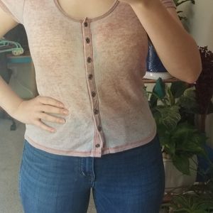 Distressed pink tee.